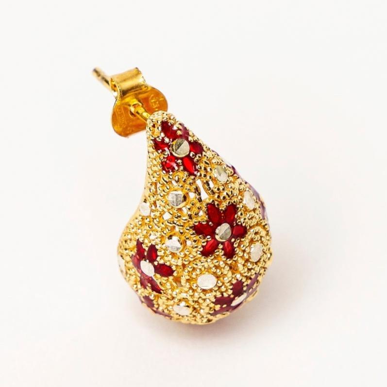 Gold-tone traditional earring with red floral enamel and white stone embellishments