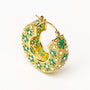 Gold hoop earring with intricate floral design featuring green enamel and textured details