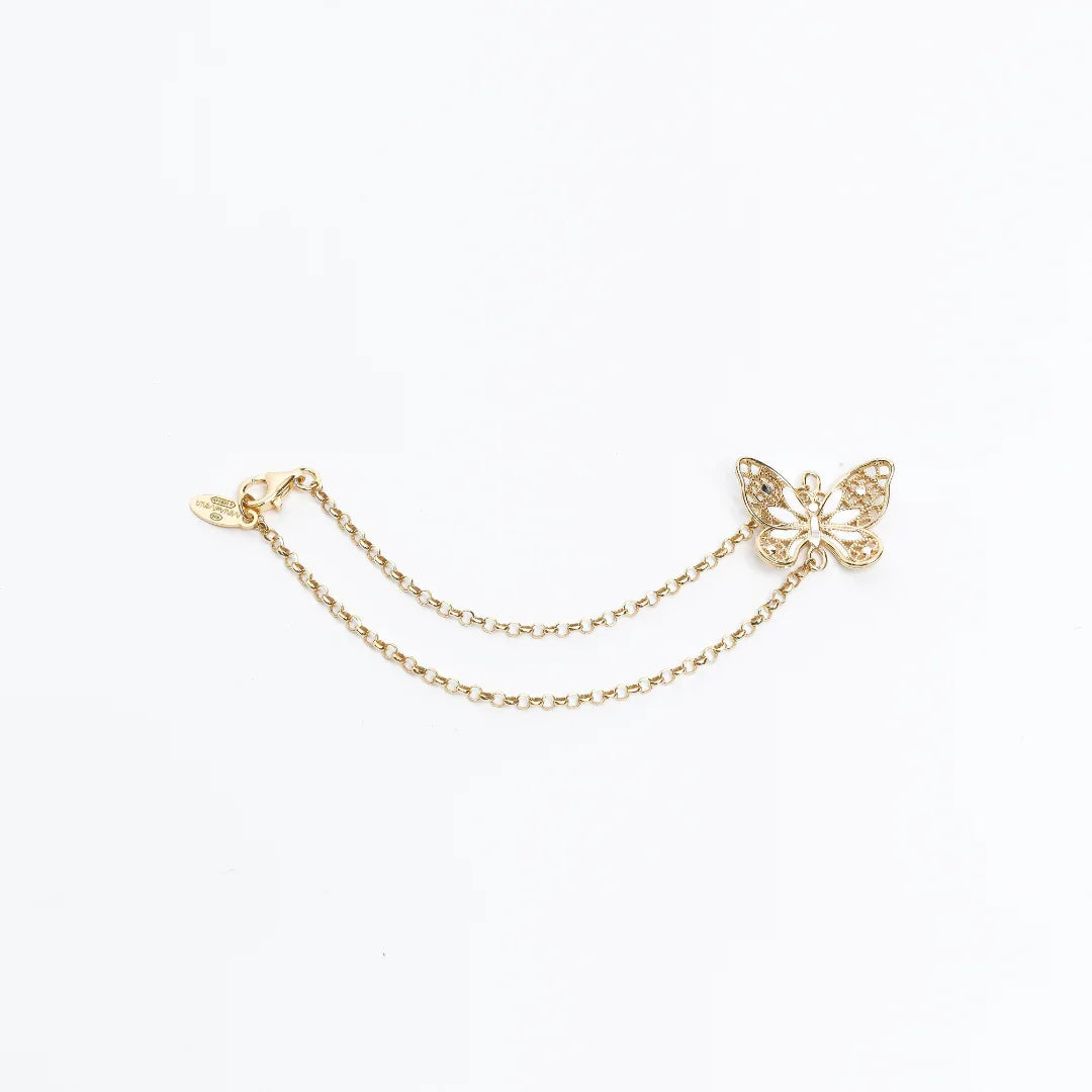 Delicate gold chain accessory featuring a filigree butterfly charm and lobster clasp