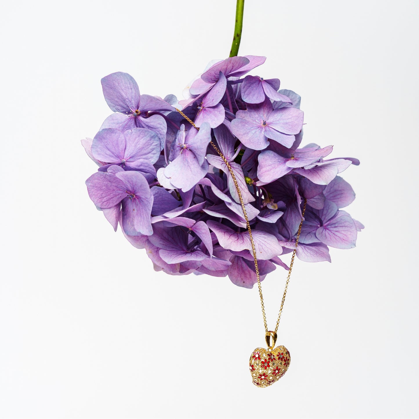 Silver necklace with enameled heart