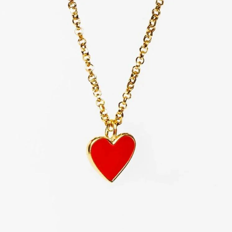Gold chain necklace with a shiny red heart-shaped pendant on a white background