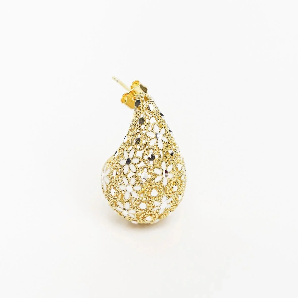 Gold teardrop-shaped floral filigree stud earring with white enamel accents