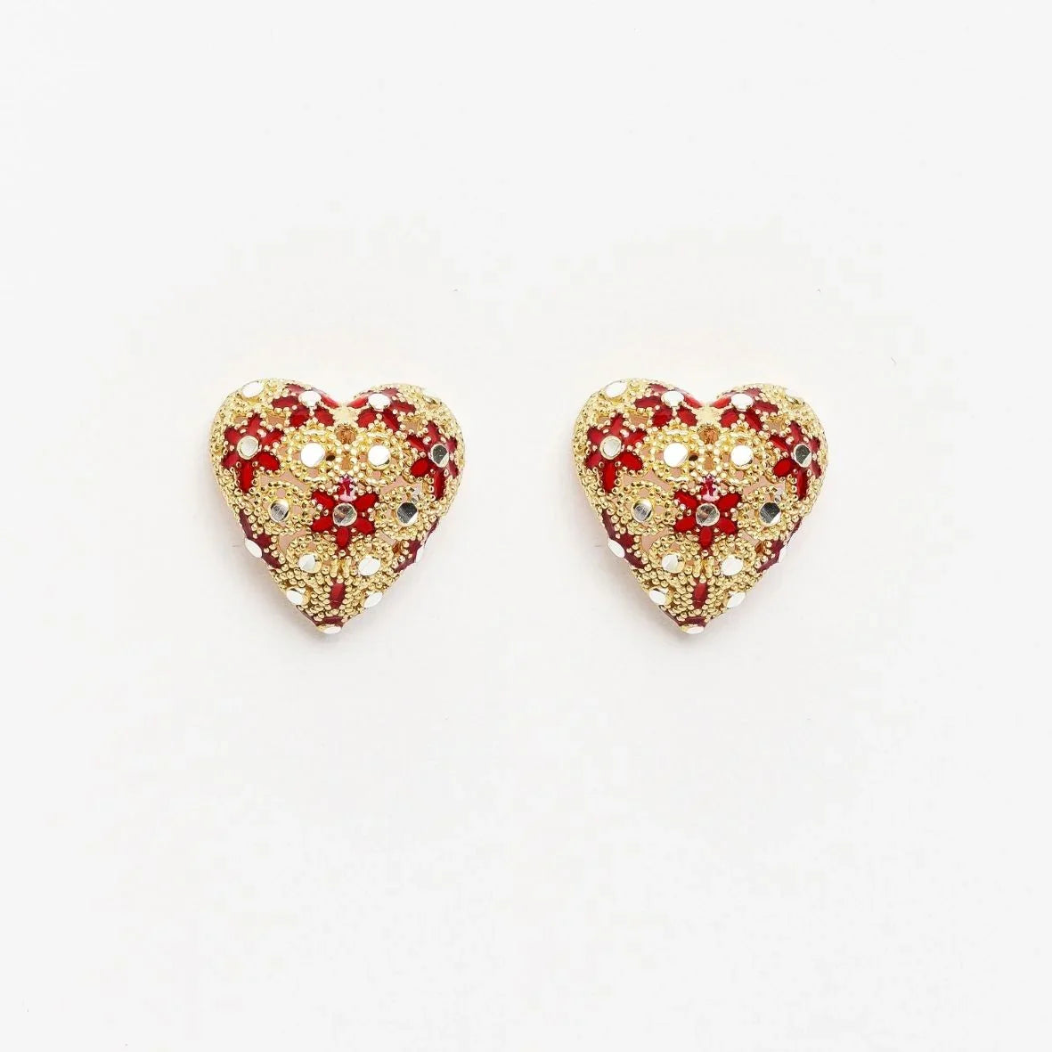 Pair of red heart-shaped earrings embellished with gold beads and small mirrors on white background