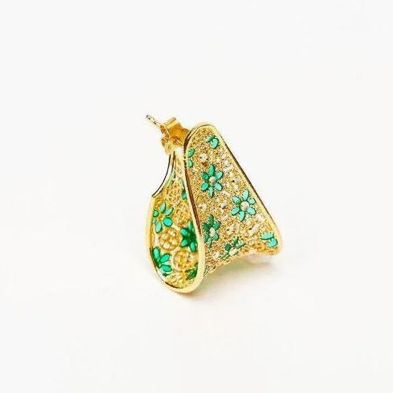 Gold hoop earring with intricate filigree and green floral enamel design on white background