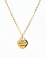 Gold necklace with heart pendant engraved Sei la mia persona and small star charm on white background