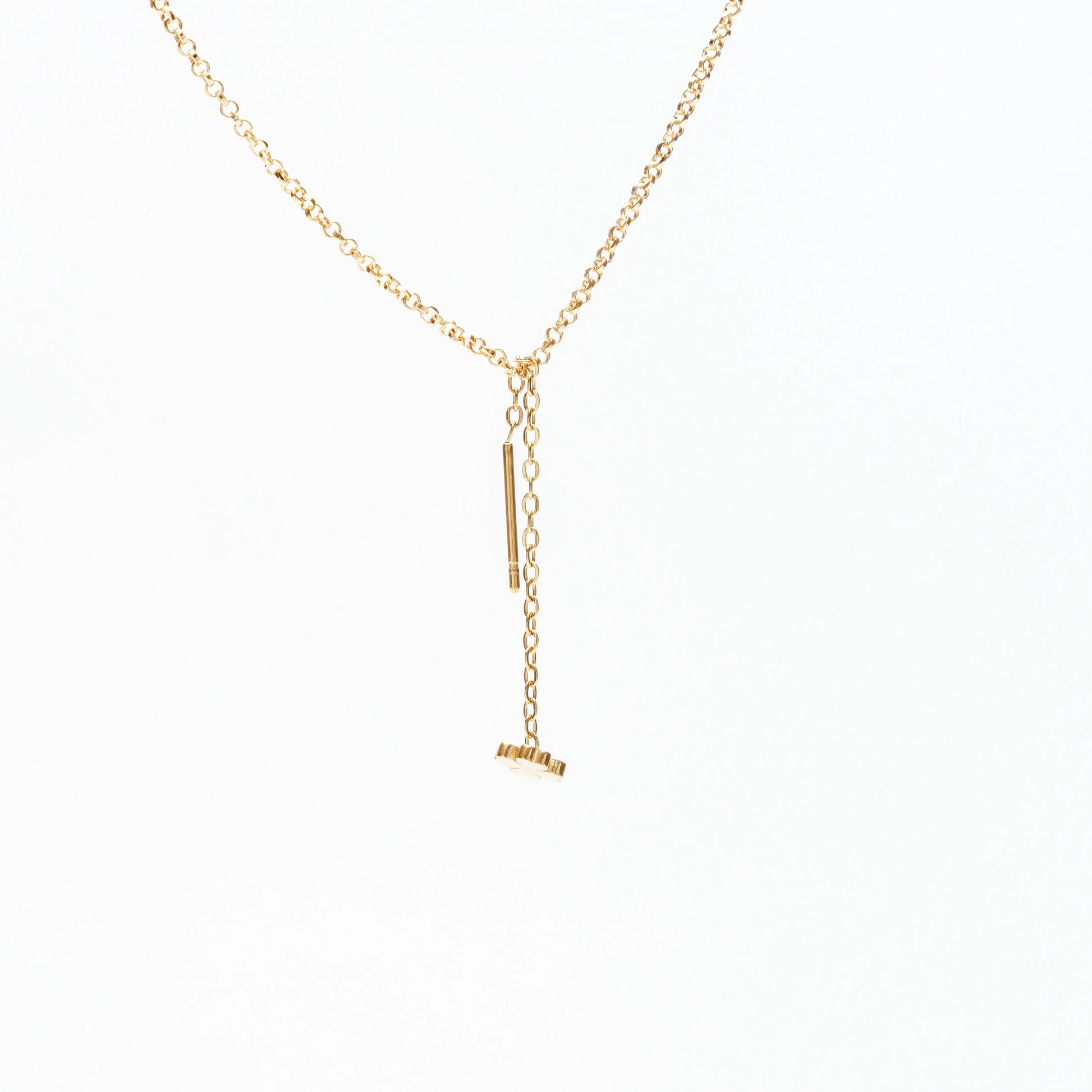 Delicate 14k gold chain necklace with adjustable toggle and flower pendant on white background