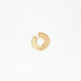 Minimalist gold circular notch hoop earring on white background