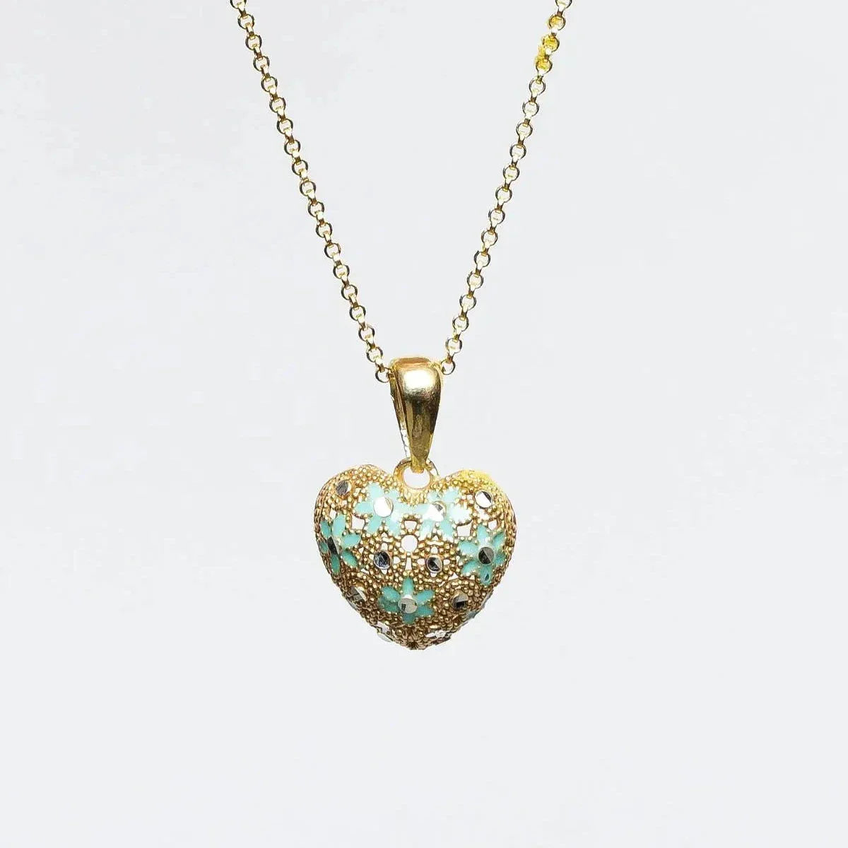 Gold heart-shaped pendant necklace with light blue floral enamel and small gemstones on white background